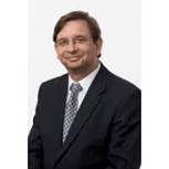 A person in a suit Description automatically generated